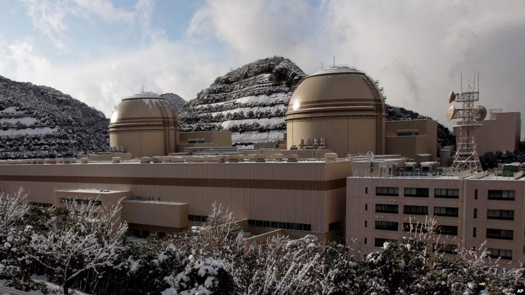 FILE - Kansai Electric Power Co.'s Ohi nuclear power plant No. 3, right, and No. 4 reactors, Ohi, Fukui prefecture, Japan, Jan. 26, 2012. A court ordered the reactor shut down Wednesday, dealing a setback to Prime Minister Shinzo Abe.