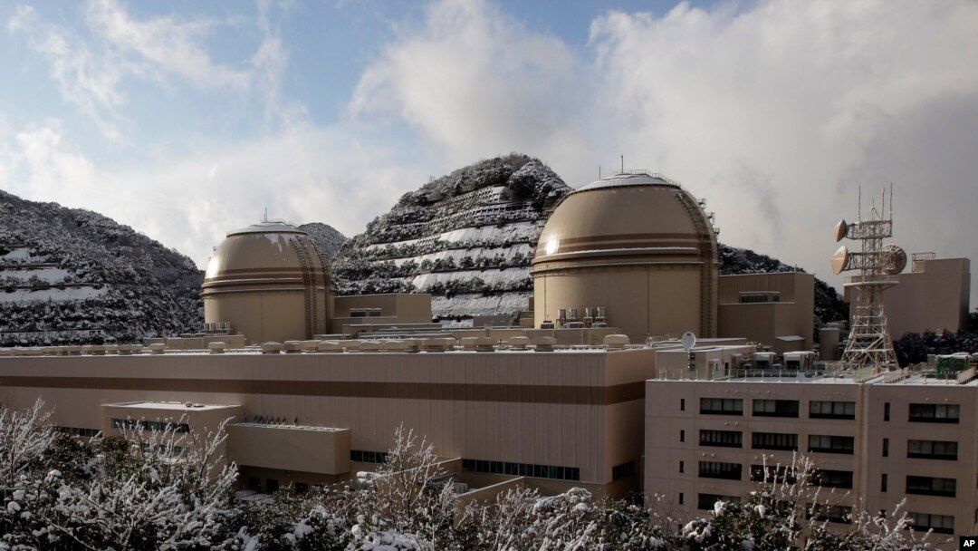 FILE - Kansai Electric Power Co.'s Ohi nuclear power plant No. 3, right, and No. 4 reactors, Ohi, Fukui prefecture, Japan. All of Japan's nuclear reactors were shut down in the aftermath of the March 2011 Fukushima disaster.
