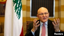 FILE - Lebanon's Prime Minister Tammam Salam speaks during an interview with Reuters in his office in Beirut, Nov. 12, 2014. 