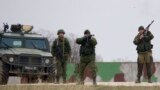Russian soldiers fire warning shots at the Belbek air base, outside Sevastopol, Ukraine, March 4, 2014.