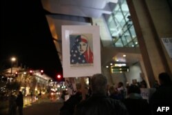 Protesters chant during a rally against the travel ban at San Diego International Airport, March 6, 2017, in San Diego, California.