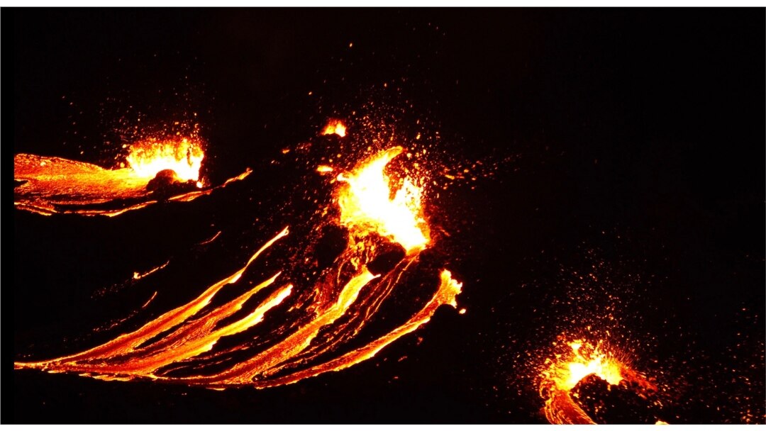In this still image captured from a handout video filmed by the Icelandic Coast Guard, lava flows from the erupting Fagradalsfjall volcano some 50 kilometers west of the Icelandic capital, Reykjavik, on March 19, 2021.