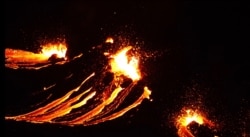 In this still image captured from a handout video filmed by the Icelandic Coast Guard, lava flows from the erupting Fagradalsfjall volcano some 50 kilometers west of the Icelandic capital, Reykjavik, on March 19, 2021.