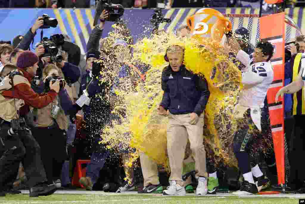 Seattle Seahawks head coach Pete Carroll is doused with Gatorade late in the second half of the NFL Super Bowl XLVIII football game Sunday, Feb. 2, 2014.
