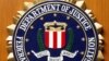 FILE - The Federal Bureau of Investigation of the Department of Justice of the United States of America emblem at the U.S. embassy in Berlin, Aug. 10, 2007.