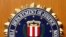 FILE - The Federal Bureau of Investigation of the Department of Justice of the United States of America emblem at the U.S. embassy in Berlin, Aug. 10, 2007.