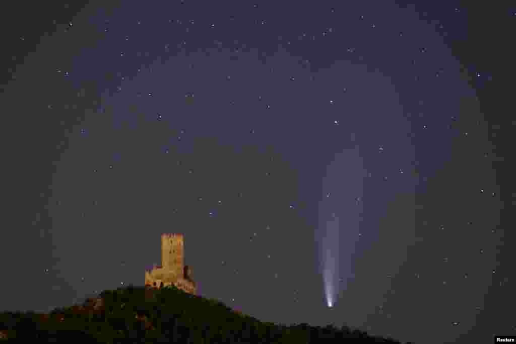 The Comet C/2020 or &quot;Neowise&quot; is seen in the sky over Ortenbourg castle, near Scherwiller, France.