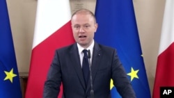 Malta's Prime Minister Joseph Muscat gives a statement announcing the arrest of suspects in the October 16 killing of journalist Daphne Caruana Galizia, in Valletta, Malta, Dec.4, 2017. In all, 10 people were arrested; three were charged Dec. 5.
