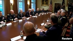 U.S. President Donald Trump participates in a briefing with senior military leaders at the White House in Washington, Oct. 5, 2017. Hours later, he called the evening the "calm before the storm."