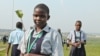 Ugandan schoolchildren end the International Children’s Climate Change Conference by planting seedlings, Kampala, Uganda, July 12, 2014. (Hilary Heuler / VOA News)