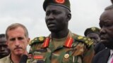 FILE - Brigadier General Lul Ruai Koang of the Sudan People's Liberation Army (SPLA) addresses the media in Juba, Aug. 29, 2017. 