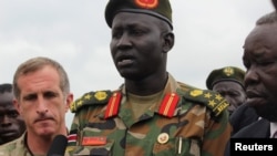 FILE - Brigadier General Lul Ruai Koang of the Sudan People's Liberation Army (SPLA) addresses the media in Juba, Aug. 29, 2017. 