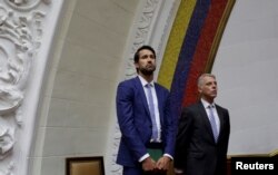 FILE - Craig Kowalik, left, political adviser to the embassy of Canada, and Eduardo Porretti, charge d'Affaires of the embassy of Argentina, attend a session of Venezuela's opposition-controlled National Assembly in Caracas, Venezuela, Aug. 2, 2017.