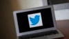 The Twitter logo as seen on a laptop computer.