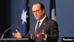 France's President Francois Hollande delivers an address at the National Gallery of Australia in Canberra, Nov. 19, 2014. 