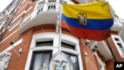 The Ecuadorian national flag flies outside their London Embassy, Tuesday, Oct. 18, 2016.