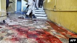 Stains of blood cover a hallway inside the Hotel Muna in Mogadishu, 24 Aug 2010