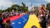 People carry Venezuela's national flag to protest the election results that awarded Venezuela's President Nicolas Maduro with a third term, in Maracaibo, Venezuela, July 30, 2024.