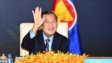 FILE - In this photo provided by the An Khoun Sam Aun/National Television of Cambodia, Cambodian Prime Minister Hun Sen gestures as he joins an online meeting of the ASEAN-China special summit at Peace Palace in Phnom Penh, Cambodia on Nov. 22, 2021. 