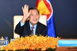 FILE - In this photo provided by the An Khoun Sam Aun/National Television of Cambodia, Cambodian Prime Minister Hun Sen gestures as he joins an online meeting of the ASEAN-China special summit at Peace Palace in Phnom Penh, Cambodia on Nov. 22, 2021. (AP Photo)