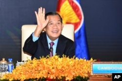 FILE - In this photo provided by the An Khoun Sam Aun/National Television of Cambodia, Cambodian Prime Minister Hun Sen gestures as he joins an online meeting of the ASEAN-China special summit at Peace Palace in Phnom Penh, Cambodia on Nov. 22, 2021. (AP Photo)