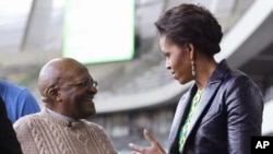 First lady Michelle Obama meets with Archbishop Desmond Tutu at Cape Town Stadium in Cape Town, South Africa, June 23, 2011.
