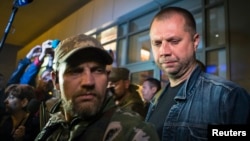 FILE - Alexander Borodai (R), Prime Minister of the self proclaimed "Donetsk People's Republic", speaks with the media.