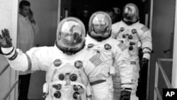 The crew of the Apollo 13 lunar landing mission are shown in their space suits on their way to the launch pad at Kennedy Space Center in Cape Kennedy, Fla., Saturday, April 11, 1970.
