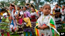 FILE - Bobby Morris, 4, of Wisconsin Dells, Wis., joins hundreds of other dancers at the Prairie Island Dakota Wacipi Celebration Pow Wow hosted by the Prairie Island Indian Community near Red Wing., Minn., on July 11, 2003.