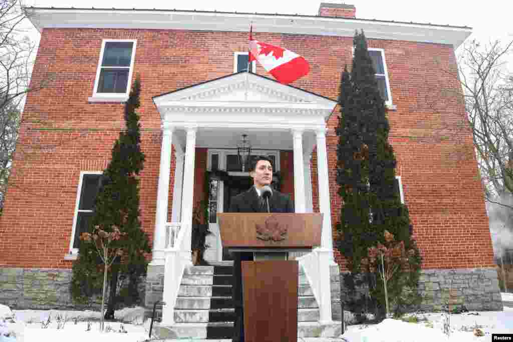 Canada&#39;s Prime Minister Justin Trudeau speaks to reporters, announcing he intends to step down as Liberal Party leader but he will stay on in his post until a replacement has been chosen,&nbsp;from his Rideau Cottage residence in Ottawa, Ontario.