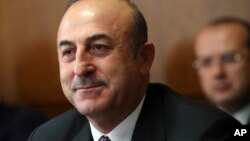 FILE - Turkish Foreign Minister Mevlut Cavusoglu attends a meeting on forming a constitutional committee in Syria at the European headquarters of the United Nations in Geneva, Switzerland, Dec. 18, 2018. 