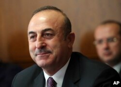 Turkish foreign minister Mevlut Cavusoglu attends a meeting on forming a constitutional committee in Syria at the European headquarters of the United Nations in Geneva, Switzerland, Dec. 18, 2018.