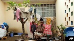 This mother and her child found refuge at the Catholic Mission in Duékoué, Ivory Coast after fleeing their home in January