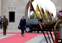 British Prime Minister Theresa May arrives to meet King Abdullah at the Royal Palace in Amman, Jordan during her visit to the Middle East, Nov. 30, 2017.