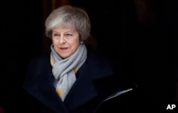 FILE - Britain's Prime Minister Theresa May leaves a cabinet meeting at Downing Street in London, Jan. 15, 2019.