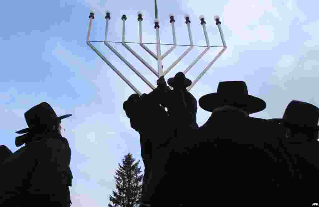 Rabbis inspect the setting-up of a large Menorah in front of the Brandenburg Gate in Berlin on December 1, ahead of a ceremony marking the Jewish celebration of Hanukkah. (Tobias Schwarz/Reuters)