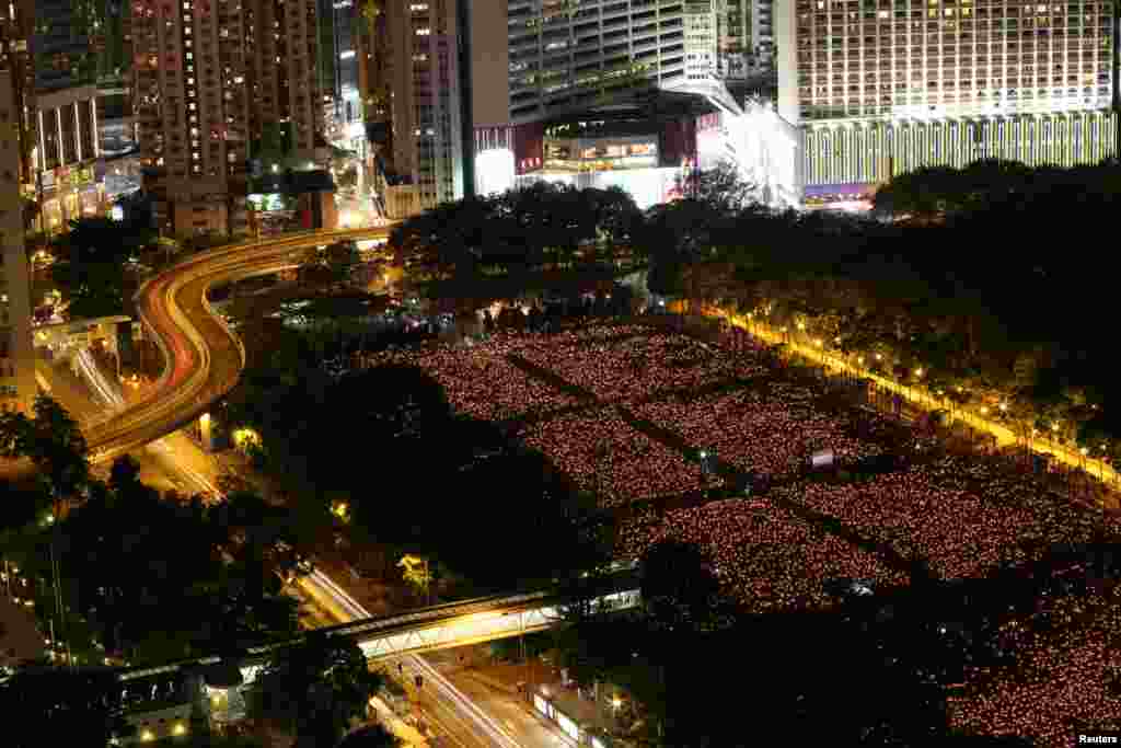 Thousands of people take park in a candlelight vigil at Victoria Park in Hong Kong, June 4, 2016, to mark the 27th anniversary of the crackdown of pro-democracy movement at Beijing&#39;s Tiananmen Square in 1989.