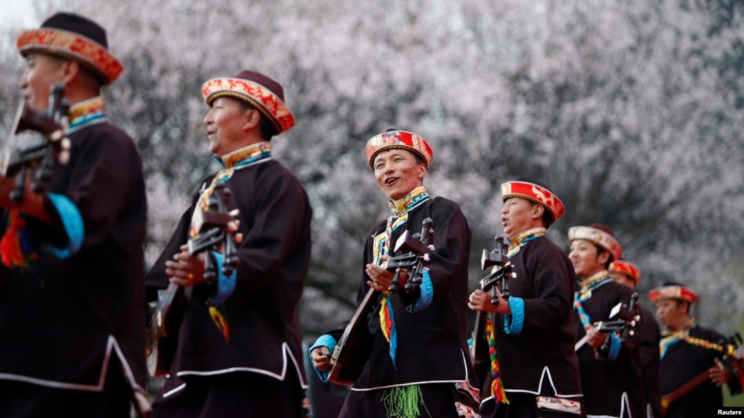 Tibetans play their traditional musical instruments to commemorate Serf Liberation Day in Nyingchi Prefecture, Tibet Autonomous Region, March 27, 2014.