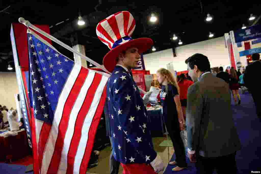 A man dressed as Uncle Sam walks at the Conservative Political Action Conference (CPAC) at National Harbor, Maryland, outside Washington D.C.