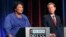 Democratic gubernatorial candidate for Georgia Stacey Abrams, left, speaks as her Republican opponent Secretary of State Brian Kemp looks on during a debate in Atlanta, Oct. 23, 2018.