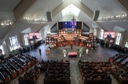 Mourners attend the funeral for the late Rep. John Lewis, D-Ga., at Ebenezer Baptist Church in Atlanta, July 30, 2020.