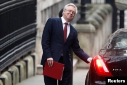 FILE - Britain's Secretary of State for Departing the EU, David Davis, leaves Downing Street in London, Jan. 25, 2017.