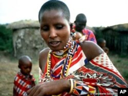 A Maasai woman in her traditional village in northern Tanzania, where the indigenous people are locked in a battle to maintain their culture