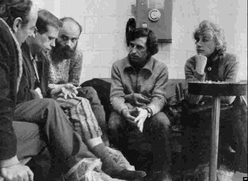 Havel's wife, Olga Havlova, when she visited him with his brother Ivan and other members of the Charta 77 disident movement Jiri, left, and Jan Ruml in a Prague hospital in February 1983. (AP)