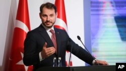 Berat Albayrak, Turkey's Treasury and Finance Minister, talks during a conference in Istanbul, Aug. 10, 2018, in a bid to ease investor concerns about Turkey's economic policy.