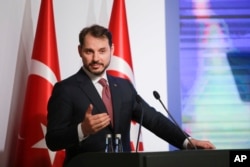Berat Albayrak, Turkey's Treasury and Finance Minister, talks during a conference in Istanbul, Aug. 10, 2018, in a bid to ease investor concerns about Turkey's economic policy.