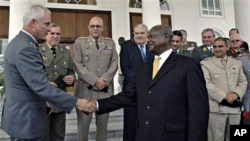 Uganda President Yoweri Museveni, right, greets European Union Military Committee Army Officers after a security meeting where they committed to support pacification of Somalia, at State House, Entebbe, Uganda, 04 Oct. 2010