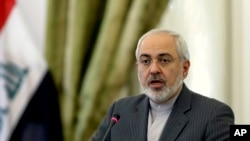 Iranian Foreign Minister Mohammad Javad Zarif speaks in a joint press conference with his Iraqi counterpart Hoshyar Zebari, in Tehran, Feb. 26, 2014. 