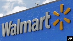 FILE - A Walmart sign is shown at a store in Hialeah Gardens, Fla., June 1, 2017.