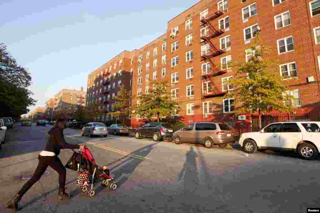 A resident pushes a stroller in the Clifton neighborhood of Staten Island in New York, Oct. 25, 2014. Also known as "Little Liberia", Clifton is now fighting against the stigma of Ebola.